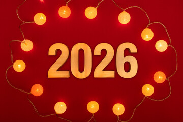 반짝이는 전구 배경에 2026년 글자 이미지