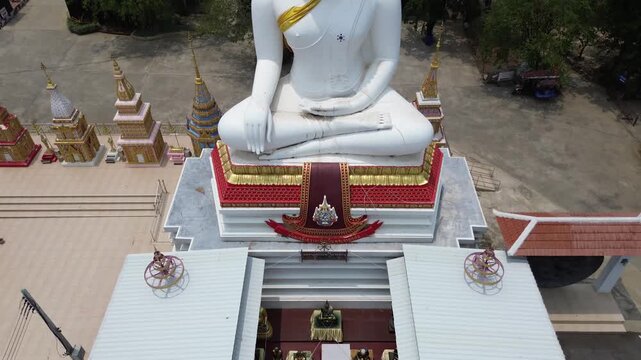Wat Pho Kao Ton Buddhist Temple White Buddha statue in Singburi, Thailand 