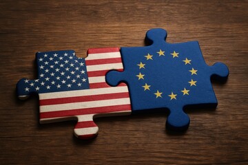 Naklejka premium Bridging Nations: The American and European Union flags, artfully crafted as jigsaw puzzle pieces, merge to symbolize unity, cooperation, and collaborative effort.
