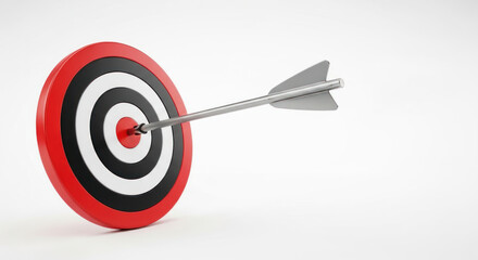 A red dart with a silver tip is stuck in the center of a red bullseye target on a white background.