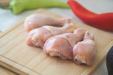 Cooking chicken legs on a cutting board