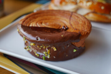 Chocolate pastry with nuts in a cafe setting