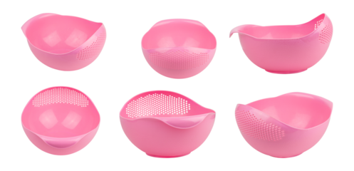 studio photograph showcasing an assortment of bright pink plastic colanders, each featuring a unique design and shape on a contrasting transparent background