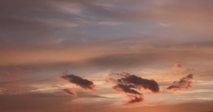 sunset with different colors and clouds as the sun sets over the horizon, multi-colored sky with warm colors and a touch of sunset or sunrise