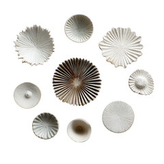 Collection of small sculptural ceramic pieces arranged neatly Isolated on a transparent background
