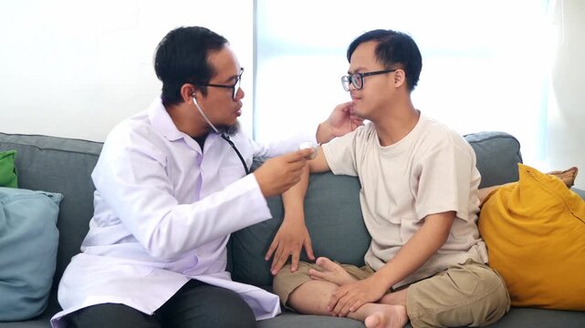 Dedicated doctor checking patient with asperger pulse
