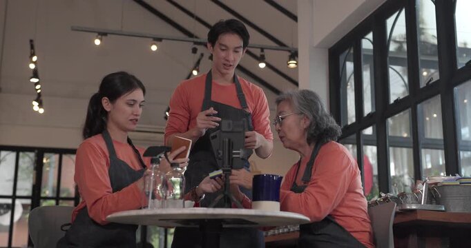 A mother, son, and daughter from a family business host a live stream, showcasing ceramic products on camera while managing orders and engagement for e commerce sales.
