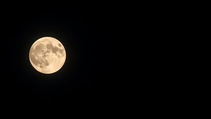 Obraz premium phase. A detailed close-up of a full moon glowing in the night sky against a dark atmospheric background. travel magazines, destination branding, designed for travel destination branding.