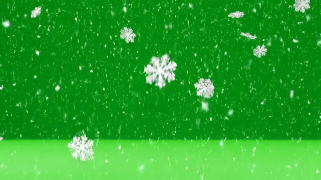 Snowflakes Falling on Green Screen - This video shows computer-generated snowflakes falling against a bright green backdrop.