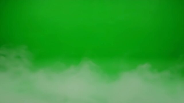 Green Screen with Fog Effect - A bright green background is shown, with a layer of fog or mist floating along the bottom portion of the frame.
