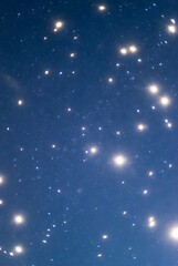 Obraz premium Celestial Glow: Starry Night Sky with Scattered Luminous Orbs