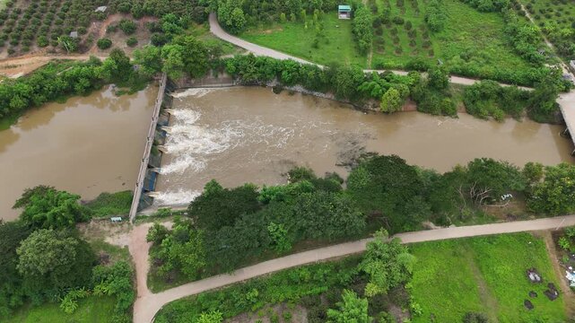 Aerial view of small spillway in Pa Daet district in Chiang Rai province of Thailand. Spillway, passage for surplus water over or around a dam when the reservoir itself is full.