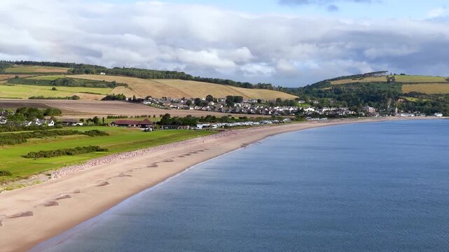 Aerial Pan Over Rosemarkie Beach and Coastal Village in Scotland