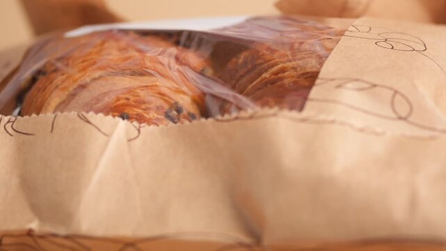 Croissant package opening in a kitchen setting