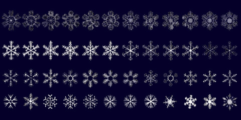 A captivating arrangement of intricate white snowflakes on a dark blue background