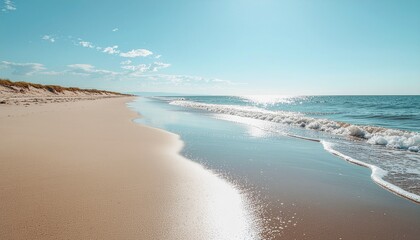 Sunny Beach with Sparkling Ocean Waves and Sand Dunes Under Blue Sky