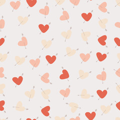 Seamless pattern with hand drawn cute hearts pierced by cupid arrows. Muted flat design for wrapping paper, fabric, or Valentine's Day concepts