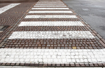 Crosswalk marking on tiles road