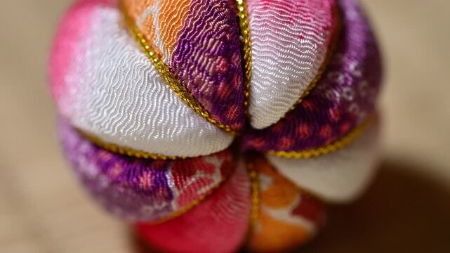Traditional Japanese Temari Ball Close Up on Tatami Mat Center