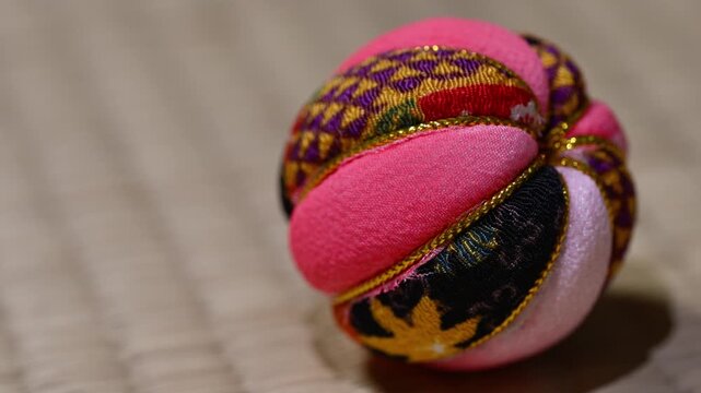 Traditional Japanese Temari Ball Close Up on Tatami Mat Center