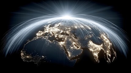 Obraz premium The illuminated Earth glows at night as bright light trails arc over it in space.