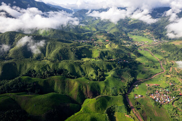 Landscape of Morning Mist with Mountain Layer. mountain ridge and clouds in rural jungle bush forest