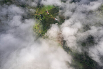 Landscape of Morning Mist with Mountain Layer. mountain ridge and clouds in rural jungle bush forest