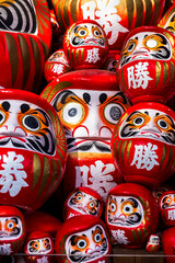 DARUMA dollss with Japaness word, which means victory, in Kachioji Temple Osaka Japan