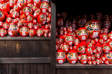 DARUMA dollss with Japaness word, which means victory, in Kachioji Temple Osaka Japan