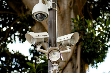 Multiple Dome and Bullet Surveillance Cameras Mounted on a Pole