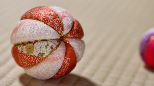 Traditional Japanese Temari Ball Rolling on Tatami Mat Right
