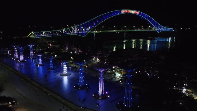 Kutai Kartanegara Bridge, East Kalimantan Indonesia, Night aerial view with car and motorcycle traffic in the middle of the bridge October 27 2021