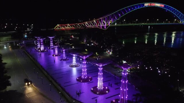 Kutai Kartanegara Bridge, East Kalimantan Indonesia, Night aerial view with car and motorcycle traffic in the middle of the bridge October 27 2021