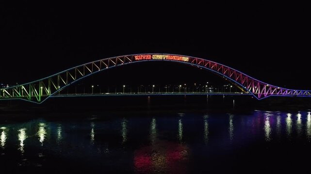 Kutai Kartanegara Bridge, East Kalimantan Indonesia, Night aerial view with car and motorcycle traffic in the middle of the bridge October 27 2021
