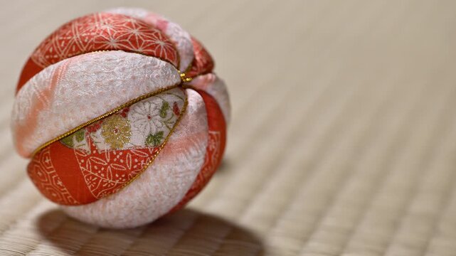 Traditional Japanese Temari Ball Gently Rolling on  Tatami Mat