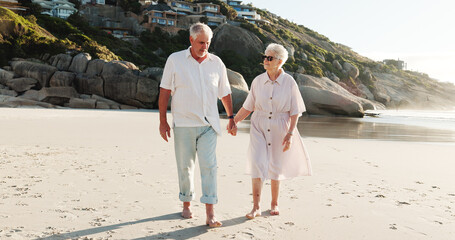 Walking, old couple and holding hands on date, beach and bonding on anniversary, loyalty or vacation. Coast, senior people and romance on summer holiday, relationship and commitment for marriage