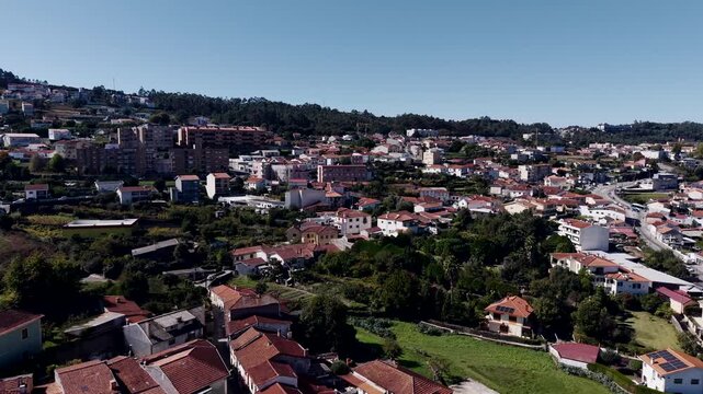 aerial view of recarei in paredes portugal with hillside homes in bright daylight