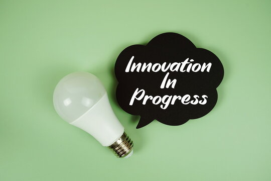 Innovation in Progress text written on speed bubble with light bulb