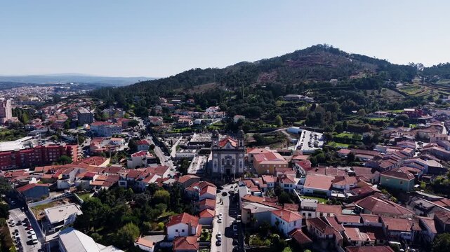 aerial approach view of Igreja Matriz de Valongo Portugal with town and hills