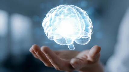 A transparent digital brain hologram floats above an open palm, representing AI, neuroscience, and modern technology. The image conveys intelligence, innovation, and futuristic thinking - Powered by Adobe