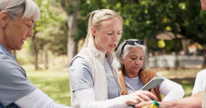 Volunteer, tablet and people in park, woman and counting inventory with online checklist. Group, outdoor and donation with social responsibility, help or digital app for charity project or food drive