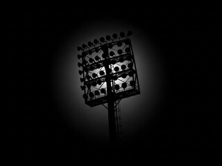 Illuminated Stadium Floodlight Tower Against Dark Background