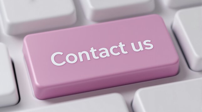 Close-up of pink Contact Us keyboard button on modern computer