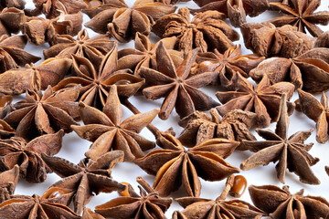 Anise seeds closeup, Detailed image of anise spice in rustic studio setting, Close perspective of anise pods and seeds against warm rustic background with rich textures