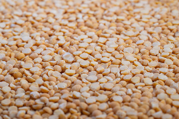 Split peas texture, Organic split peas for nourishing vegan dishes and soups, Natural textured legumes with warm colors ideal for healthy plantbased recipes and meal preparation