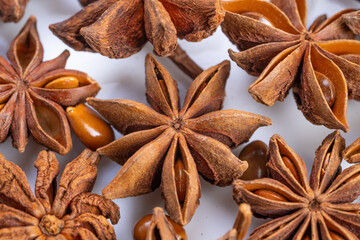 Rustic market scene with aromatic star anise and scattered seeds, Vibrant market stall featuring star anise pods with warm tones and textured surfaces for culinary appeal