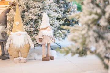 Blue Christmas tree with snowflakes falling on its branches