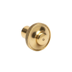 Obraz premium Polished brass knob with ribbed edge and central indentation isolated on transparent