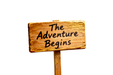 Rustic wooden sign with the handwritten words the adventure begins on a transparent background