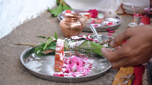 Authentic scene of a traditional Indian marriage vidhi, capturing sacred rituals performed around the holy fire (Agni) under a decorated mandap